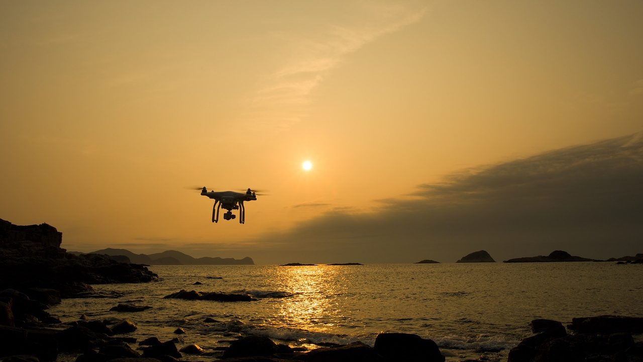 A drone is flying on the Sea.