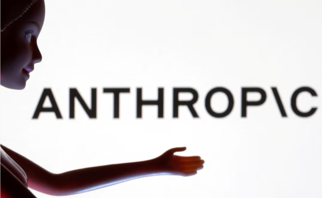 "Silhouette of a doll extending its arm toward the word 'ANTHROPIC' displayed in bold black letters on a white background."

