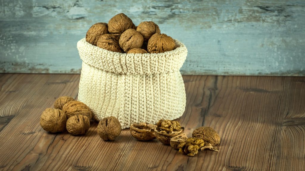 A white bag full of walnuts