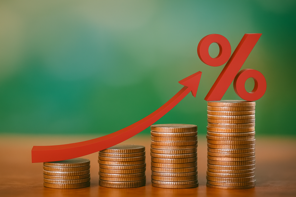 Stacks of coins increasing in height with a red upward arrow and percentage symbol, symbolizing rising financial pressure.