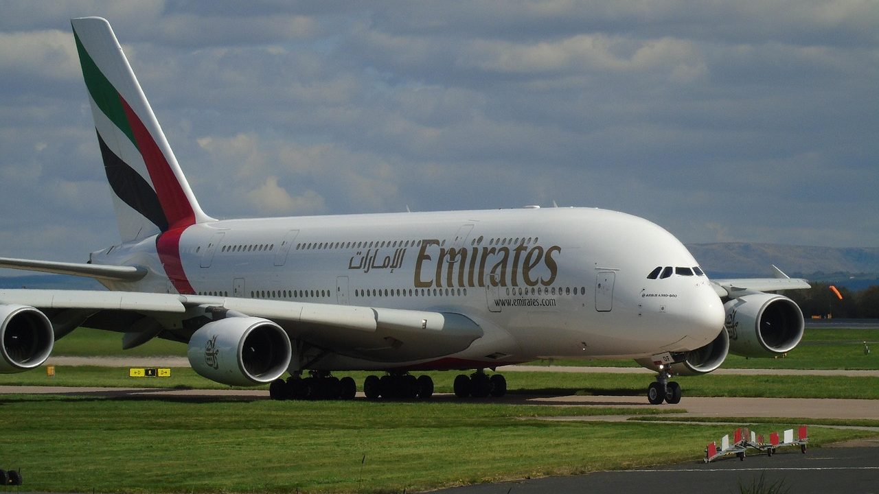 Emirates Airbus A380 parked at an airport.