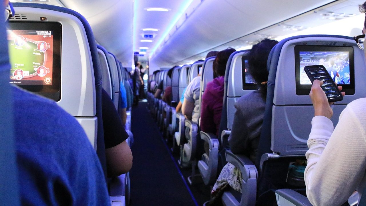 Passengers seated inside an Air Karachi aircraft during its 2025 launch, highlighting modern in-flight entertainment and enhanced travel experience for domestic and global routes.