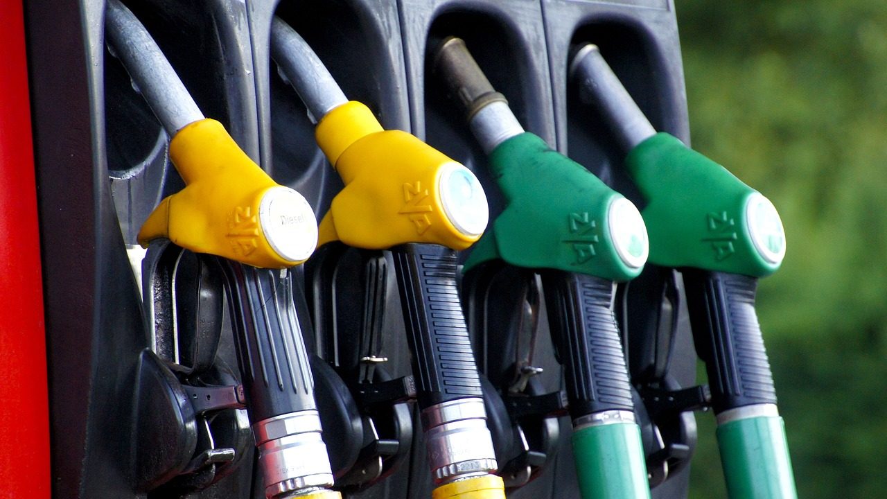 Fuel pump nozzles for petrol and diesel at a filling station, symbolizing the government’s recent price hike of Rs4.80 for petrol and Rs7.95 for diesel.