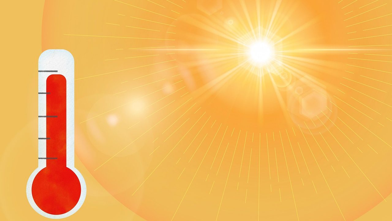 The image shows a glowing sun and a full thermometer, symbolizing extreme heat or a heatwave.