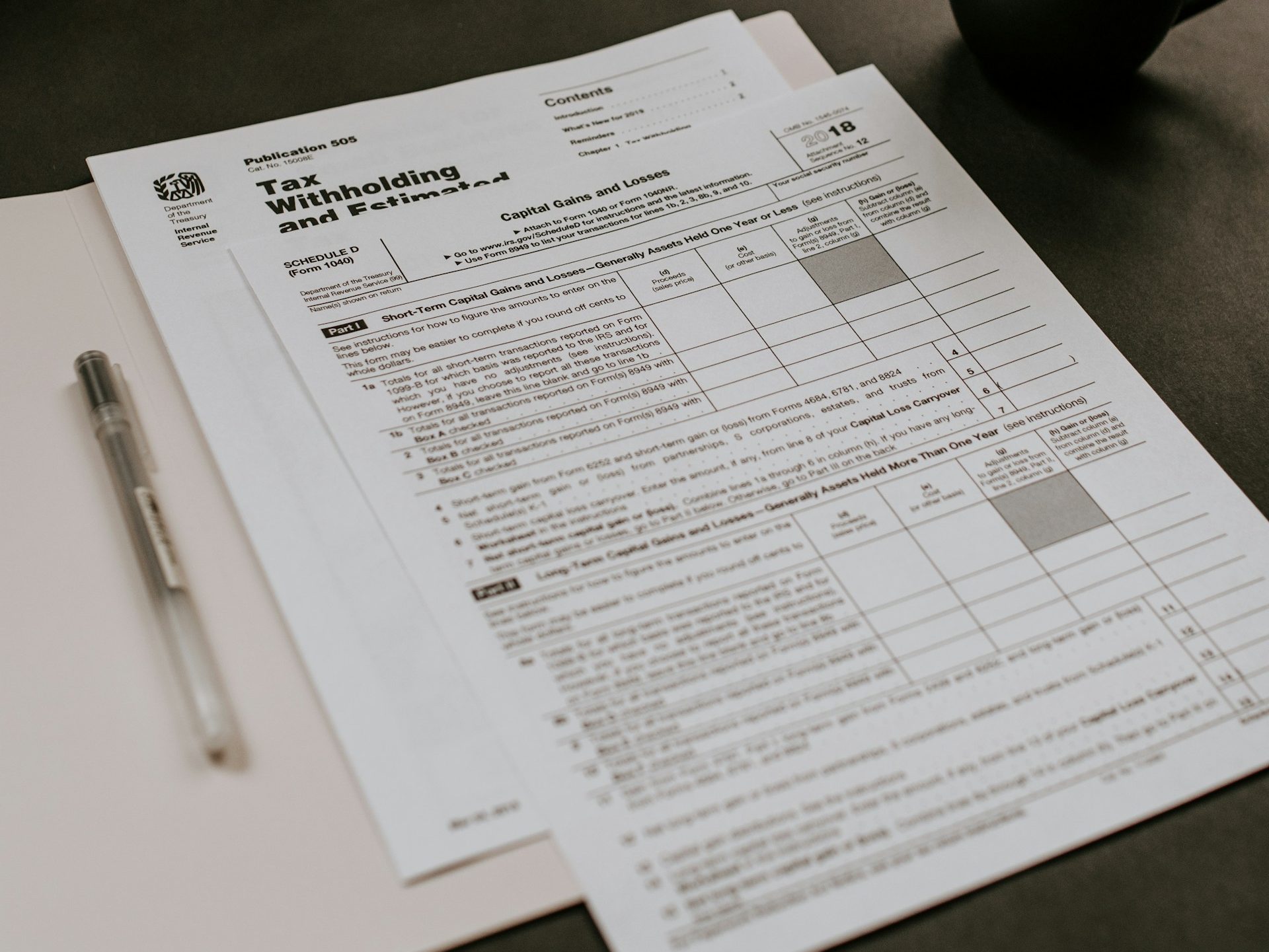 Tax documents on desk, representing new taxes on online shopping in Pakistan.