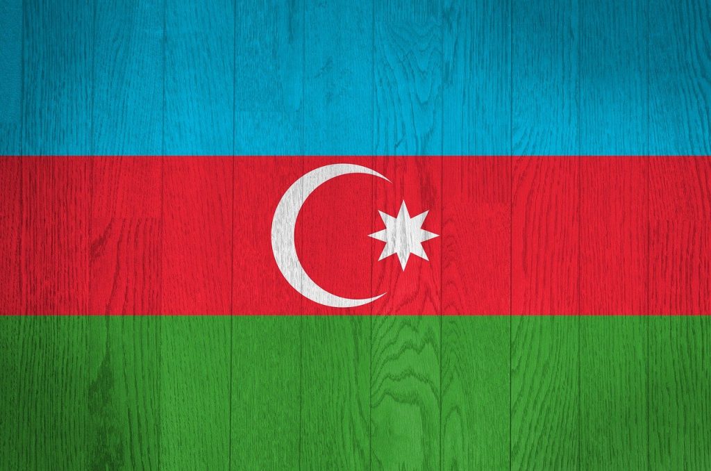 Azerbaijan national flag painted on wooden planks — representing the topic of Azerbaijan visa requirements for Pakistani travellers.