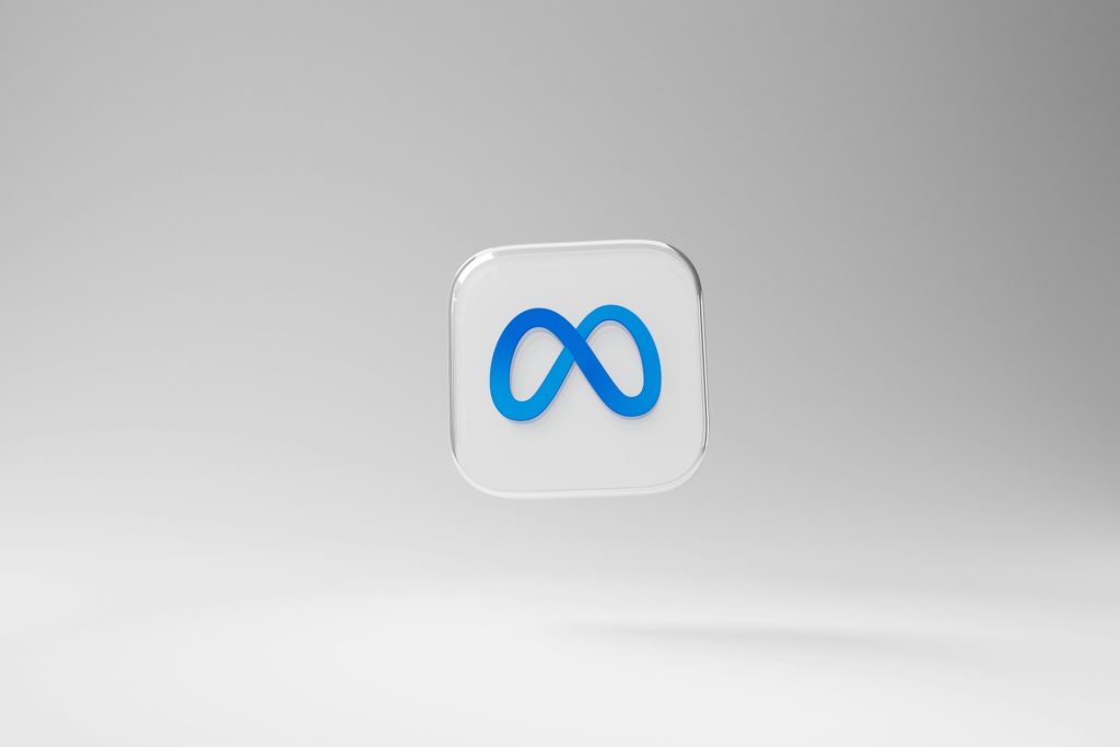A 3D Meta logo with a blue infinity symbol floats against a grey background, representing Meta’s push toward AI superintelligence and tech dominance.