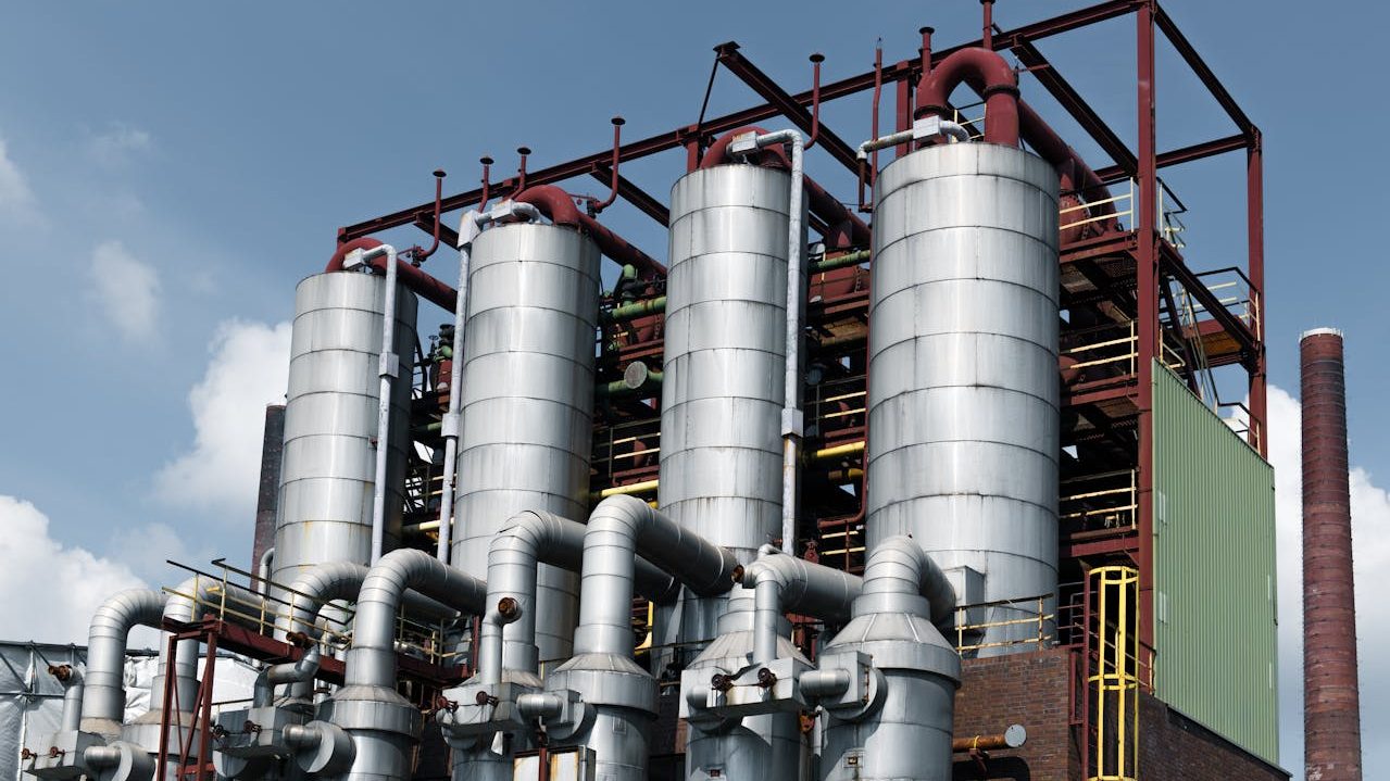 Close-up view of an industrial facility with large steel processing units and interconnected pipelines, representing efforts under a deal with Russia to revive Pakistan Steel Mills.
