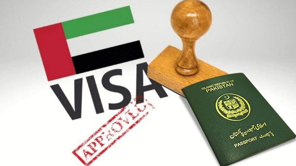 A Pakistani passport placed beside a wooden stamp and the word "VISA" featuring the UAE flag, with a red "APPROVED" mark, symbolizing simplified visa access for Pakistanis to the UAE.